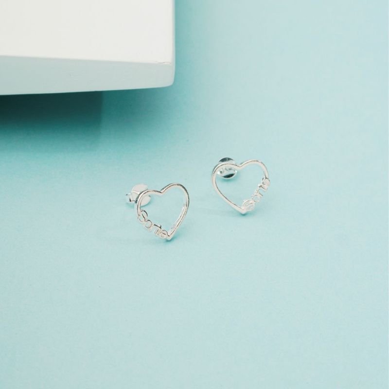 Brinco Coração Vazado 11mm (Modelos Fé ou Sorte): Prata 925 para Revenda com Significado